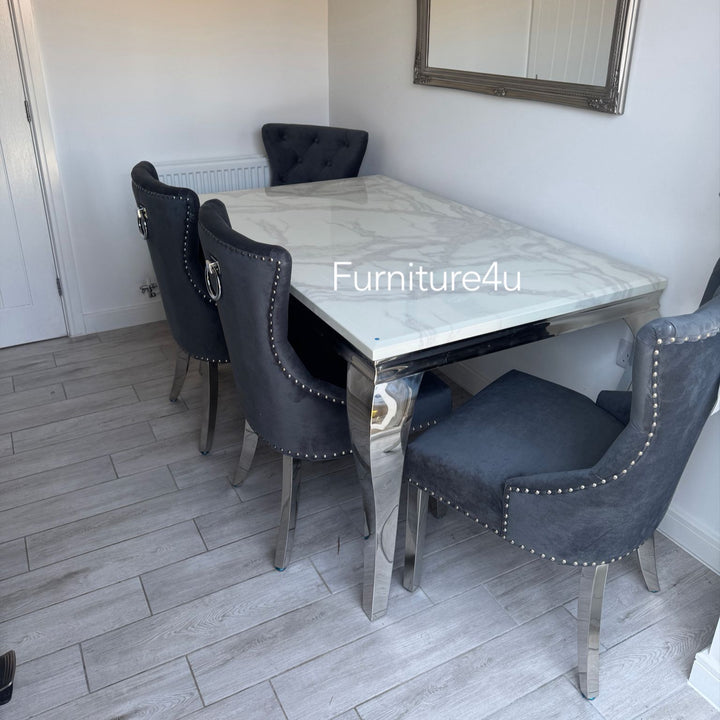 Dining room with a marble table and dark chairs, featuring the brand 'Furniture4u'.