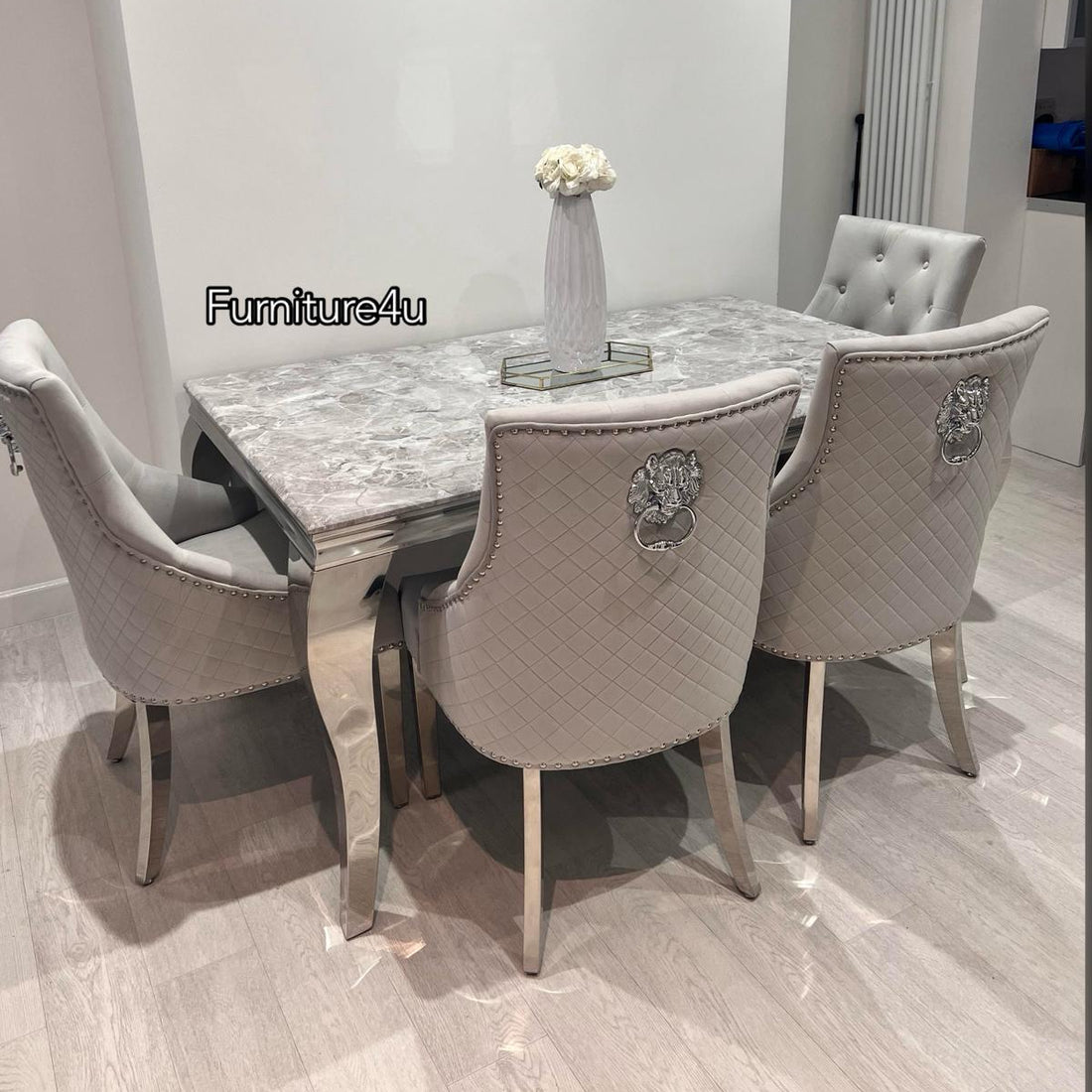 Dining table set with chairs in a modern room, featuring 'Furniture4u' branding.